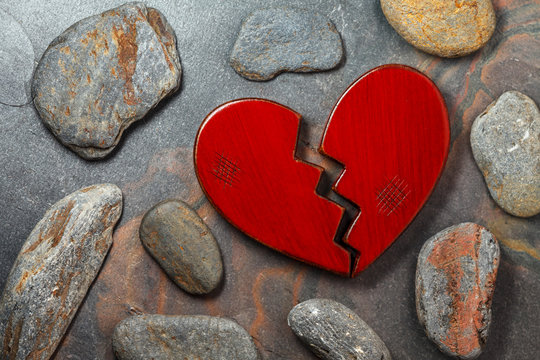 Broken heart on stone background