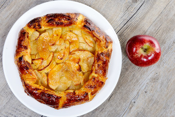 apple pie on a white plate on a table