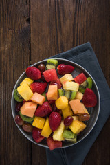 Plate full of healthy exotic fruits slices