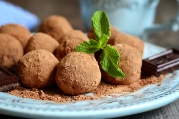 Chocolate truffles on a vintage plate.