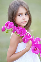 Fototapeta premium portrait of little girl outdoors in summer