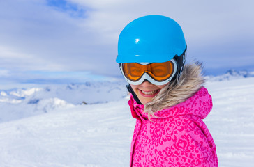 Girl skier in winter resort