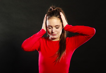 Offended woman not listening covering ears.