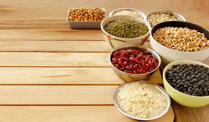 Deurstickers Different kinds of Grains, five grains put on wooden background. © Jazper4153