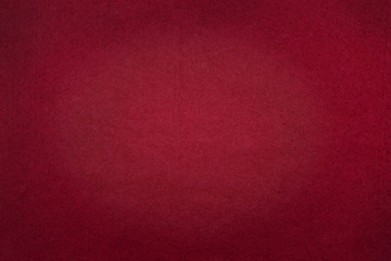 Poker table felt background in red color