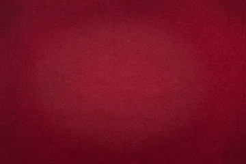 Poker table felt background in red color