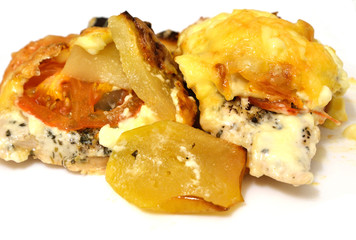 Meat with vegetables baked with cheese.