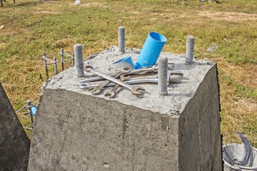 concrete piles in construction site - Concrete boring pile foundation under
construction in wet process with wrench tools