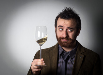 Handsome businessman holding a glass of wine