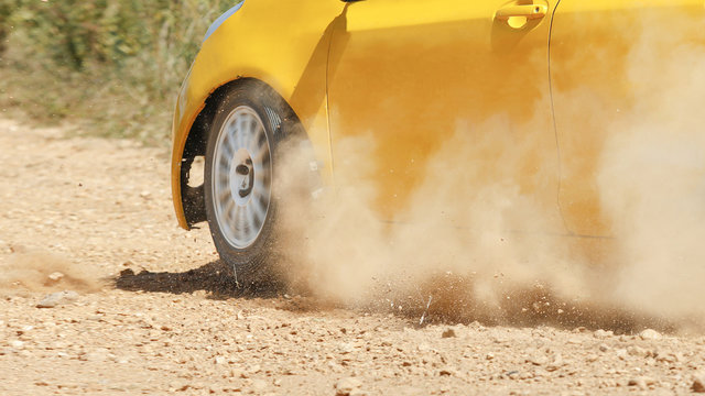 Rally car in dirt track