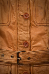 Texture a shabby brown leather jacket.