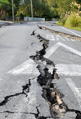 Enormous cracks in a road caused by a devastating earthquake in Christchurch, New Zealand.
