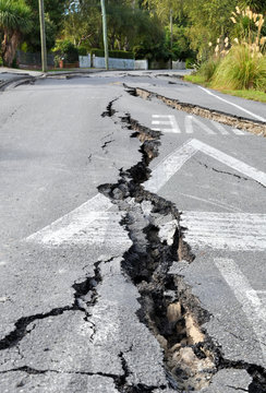 Enormous cracks in a road caused by a devastating earthquake in Christchurch, New Zealand.