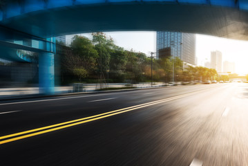 sunrise skyline and road through bridge