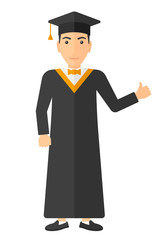 Graduate showing thumb up sign.