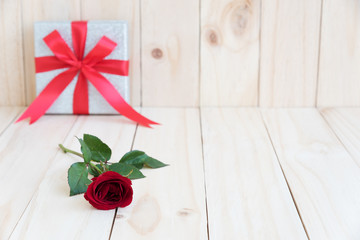 red rose on wooden background