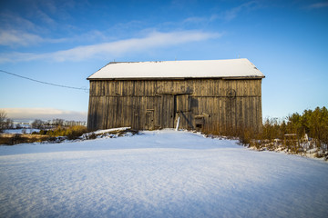 Fototapeta na wymiar Snow Covered Old Barn