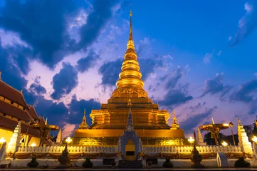Foto op Plexiglas he golden temple Landmark of Nan is Wat Phra That Charehang was built in 1355. It is the most sacred wat in Nan Province Thailand © joesayhello