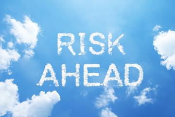 risk ahead cloud word on sky.