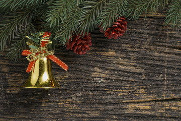 Still life of christmas ornament and tree branch on wooden board