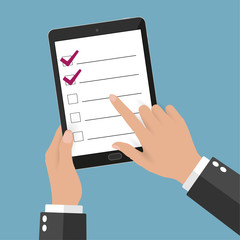 Hand touching blank screen of tablet computer