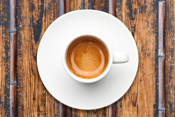 top view a cup of espresso coffee on wooden table
