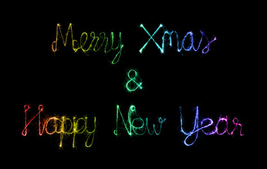 Obraz premium Merry Xmas and Happy New Year made of sparkles firework