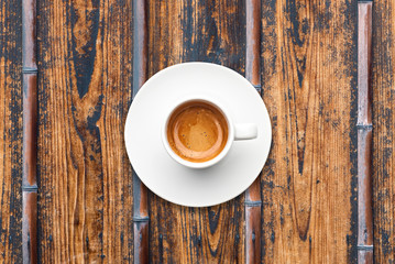 top view a cup of espresso coffee wooden bamboo table