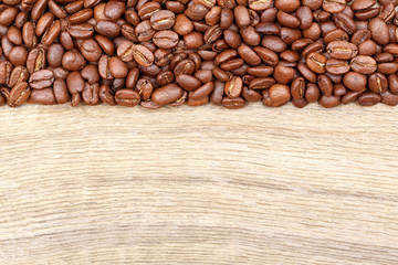 Coffee beans on old wood table. Top view.