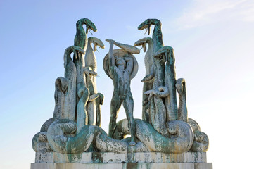 statue with snakes and man against the sky in Helsingor