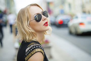Beautiful blonde woman in sunglasses