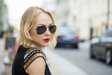 Beautiful blonde woman in sunglasses