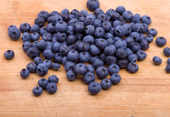 Blueberries on wooden texture background