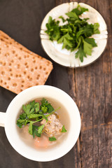 Soup with meatballs and parsley