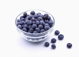 ripe blueberries in bowl isolated on white