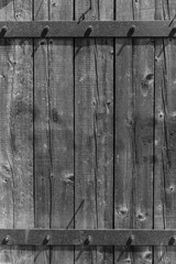wooden planks background with black metal bar