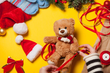 woman hands and teddy bear toy