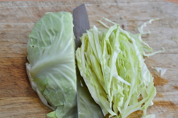 cabbage slice on wooden chop block
