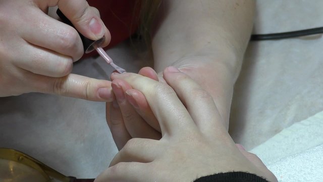 Girl doing beautiful nail design