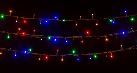 colorful Christmas lights on black background - 97717819