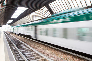 Naklejka premium Fast Passenger Commuter Train with Motion Blur
