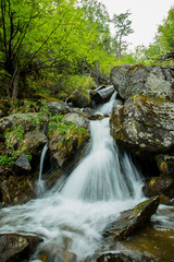 Naklejka na ściany i meble waterfall in the mountains of Lake Baikal