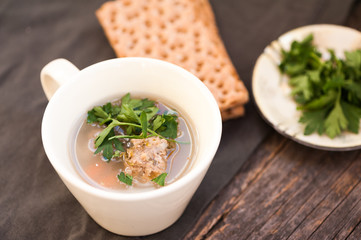 Soup with meatballs and parsley