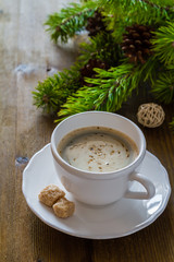 Obraz na płótnie Canvas Coffee in white cup with christmas tree