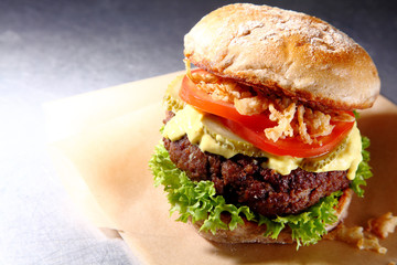 Tasty beef burger with salad trimmings