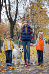 Obraz premium Kids with his dog labrador