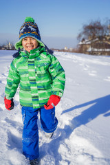 Boy plaing in the snow