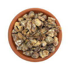 Pitted chopped dates in a small bowl top view