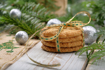 Christmas cookies with decoration on wooden background