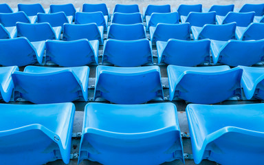 Blue bench or chair or seat from back view in the stadium.